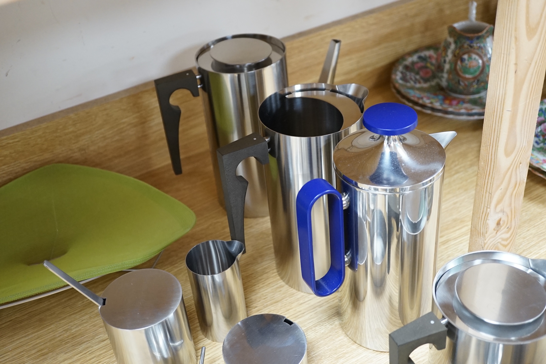 A thirteen piece suite of Arne Jacobsen stainless steel cylinder ware, coffee pot 24cm high